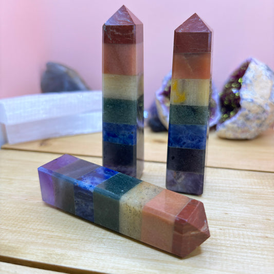This beautiful 7 Chakra Crystal Obelisk is composed of polished and bonded natural crystals, each representing a different Chakra. These pieces are formed through a meticulous design process of moulding and connecting individual stones, creating the multi-layered effect