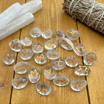 This beautiful set of Clear Quartz runes can be used to bring new energy to your divination, magic, and meditation practices  This set of runes is intricately-carved with the ancient symbols of the gods of the North, and includes a charming pouch for easy carrying. Each set has 25 Runes, 24 with characters on them and a single blank rune