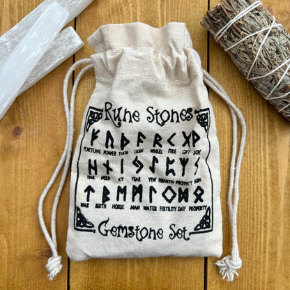 This beautiful set of White Agate runes can be used to bring new energy to your divination, magic, and meditation practices  This set of runes is intricately-carved with the ancient symbols of the gods of the North, and includes a charming pouch for easy carrying. Each set has 25 Runes, 24 with characters on them and a single blank rune