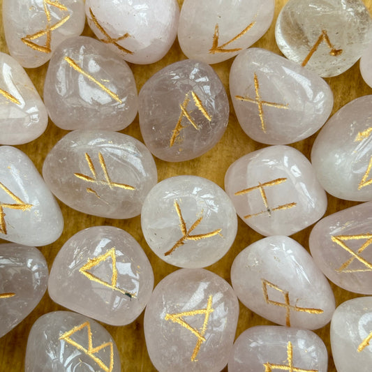 This beautiful set of Rose Quartz runes can be used to bring new energy to your divination, magic, and meditation practices  This set of runes is intricately-carved with the ancient symbols of the gods of the North, and includes a charming pouch for easy carrying. Each set has 25 Runes, 24 with characters on them and a single blank rune