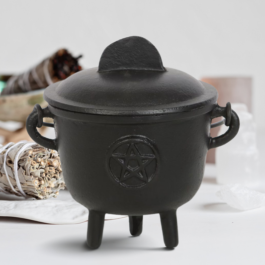Enhance your altar space with this stunning Cast Iron Cauldron, adorned with a Pentagram motif  Expertly crafted for use in rituals and spell work, this cauldron offers exceptional versatility for various practices such as creating moon water, scrying, and blending herbs and ingredients