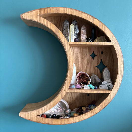 This beautiful light wood grain effect crescent moon shelf is the perfect way to bring an ethereal touch to your home décor! A wonderful statement piece, its unique shape make it a truly one-of-a-kind celestial addition to any home. Perfect for displaying your favourite crystals, or trinkets