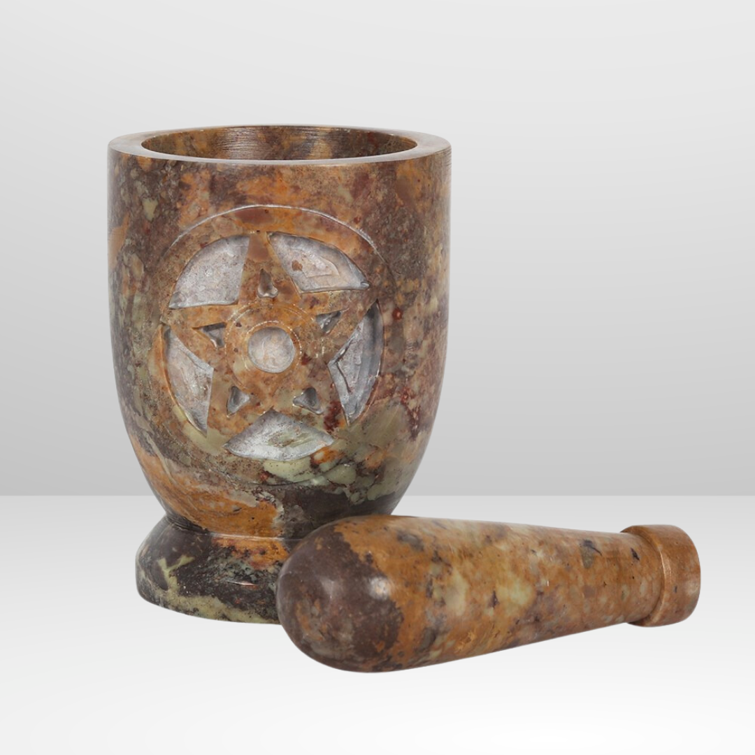 Enhance your herbal remedies and spells with the Stone Pentagram Mortar and Pestle. Made from durable and natural stone, this set features a pentagram design that represents the elements of earth, air, fire, water, and spirit. Use it to grind and mix your ingredients with precision and intention