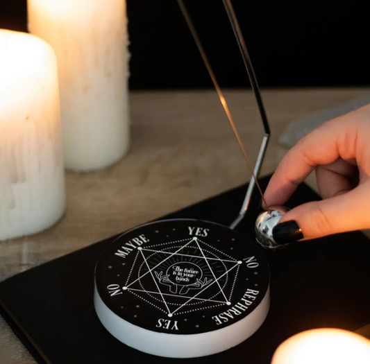 With a mystic pentagram design, this metal decision maker features a spherical pendulum that magically selects one of six responses  Simply ask your desired 'yes' or 'no' question and watch as the pendulum cycles through the possible outcomes and lands on your destiny  Perfect in size for keeping on desktops and side tables for quick decision-making