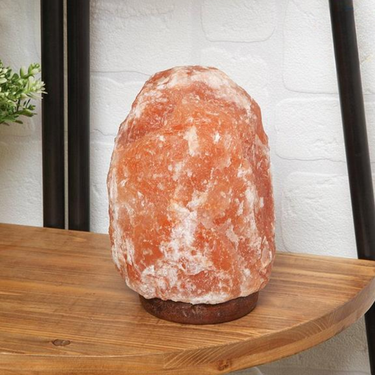 Enhance your well-being with our hand-carved, 100% natural Himalayan Rock Salt lamp. Experience the numerous health benefits it offers, including improved sleep, elevated mood, and reduced stress. This unique lamp emits negative ions, acting as a natural air purifier and reducing electromagnetic radiation from electronic devices