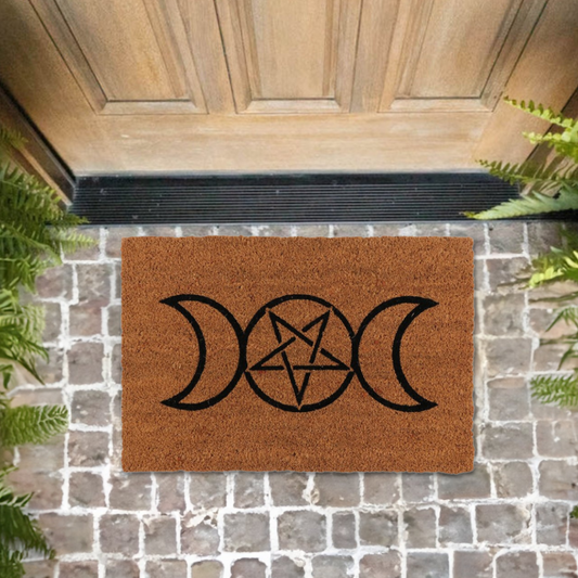 Enhance your home and create a welcoming space with this natural coir doormat printed with a Triple Moon design. The Triple Moon is a popular symbol representing the Triple Goddess and is characterised by a waxing, full and waning moon. Makes a fun welcome at the front door of any witch's lair!