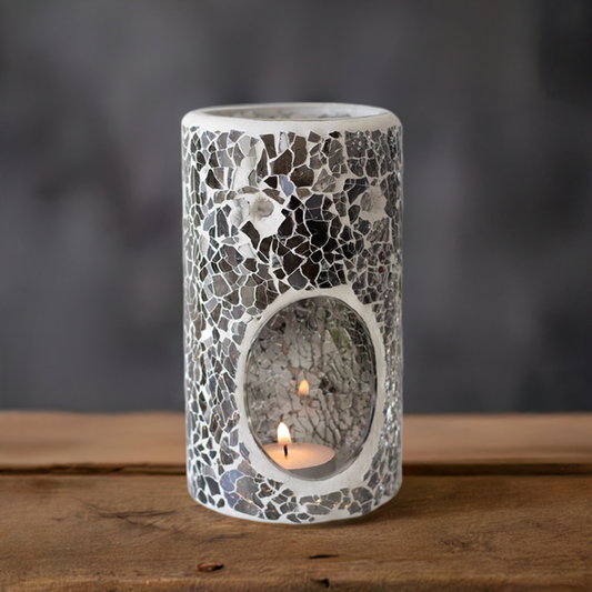 Add some warmth and style to any room with pillar shaped oil burner with a gunmetal grey mirrored crackle effect. With its sleek and modern design, this warmer not only diffuses your favorite oils and wax melts, but also doubles as a cool statement piece