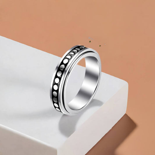 Stay cool, calm, and collected while you fidget with this silver spinning anxiety ring!