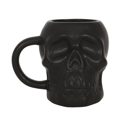 Add some edge to your morning coffee routine with this cool Black Skull Mug. This mug features a unique matt black design that is perfect for those who aren't afraid to break the mould. Whether you're sipping on coffee, tea, or something stronger, this mug is sure to make a statement