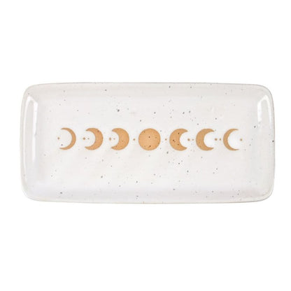 Expertly crafted with delicate stoneware, this trinket dish showcases the enchanting phases of the moon. Imbued with aesthetic value and functionality, it's the perfect addition to any home décor. A wax resist finish gives this piece a stunning, handmade feel that fits a wide range of home décor styles
