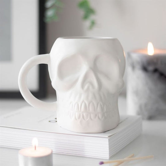 Sprinkle some macabre into your morning routine with this cool ceramic White Skull Mug. Its ghostly matte finish and bony design will wake you up with a dose of edginess
