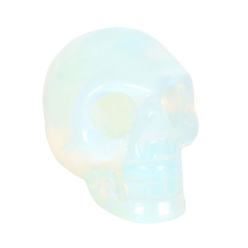 This crystal skull is made from opalite which is a stone renowned for its ability to evoke feelings of love, hope, and generosity. The skull is the perfect size for holding in the palm of your hand then you need a little support or reassurance. This unique piece serves as a stylish desk accessory, always within arm's reach for those moments of need. Presented in a black drawstring pouch for keeping the skull safe whilst on the go.