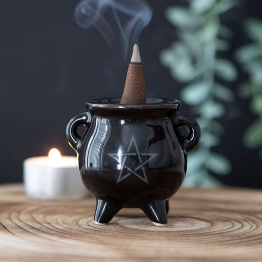 Get ready to cast some good vibes with our quirky Pentagram Cauldron Ceramic Incense Holder! This unique holder is perfect for burning your favorite incense, while adding a touch of whimsy to any room. With its pentagram design and ceramic material, it's both functional and stylish. Perfect for all the witches and wizards out there!