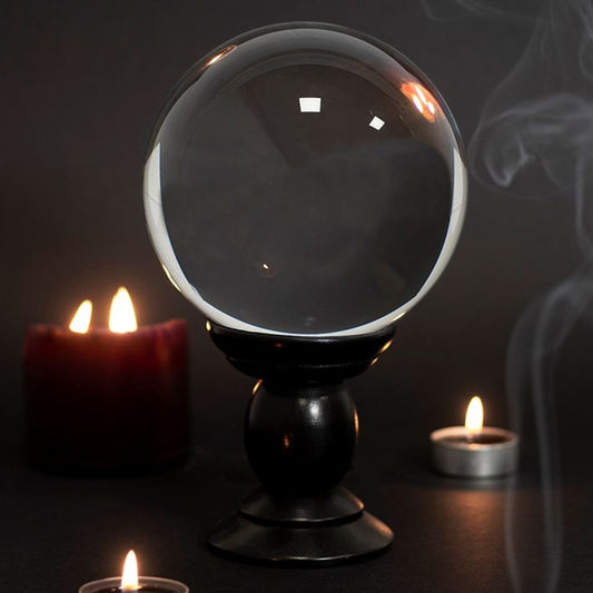 This large, clear crystal ball is not only a powerful tool in fortune telling and scrying, but also makes an eye-catching piece of d?cor. Whether used for divination or a table accessory at Halloween, this crystal ball is sure to be a conversation piece. Comes on black wooden stand