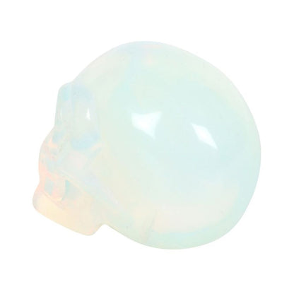 This crystal skull is made from opalite which is a stone renowned for its ability to evoke feelings of love, hope, and generosity. The skull is the perfect size for holding in the palm of your hand then you need a little support or reassurance. This unique piece serves as a stylish desk accessory, always within arm's reach for those moments of need. Presented in a black drawstring pouch for keeping the skull safe whilst on the go.