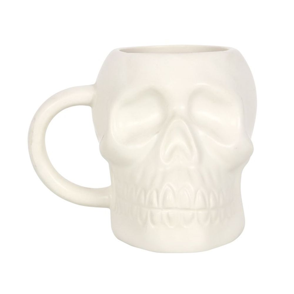 Sprinkle some macabre into your morning routine with this cool ceramic White Skull Mug. Its ghostly matte finish and bony design will wake you up with a dose of edginess