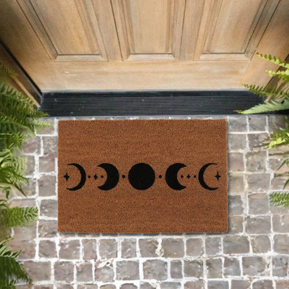 Enhance your home and create a welcoming space with this moon phase doormat made from coir in a natural colouring with a black moon phase design