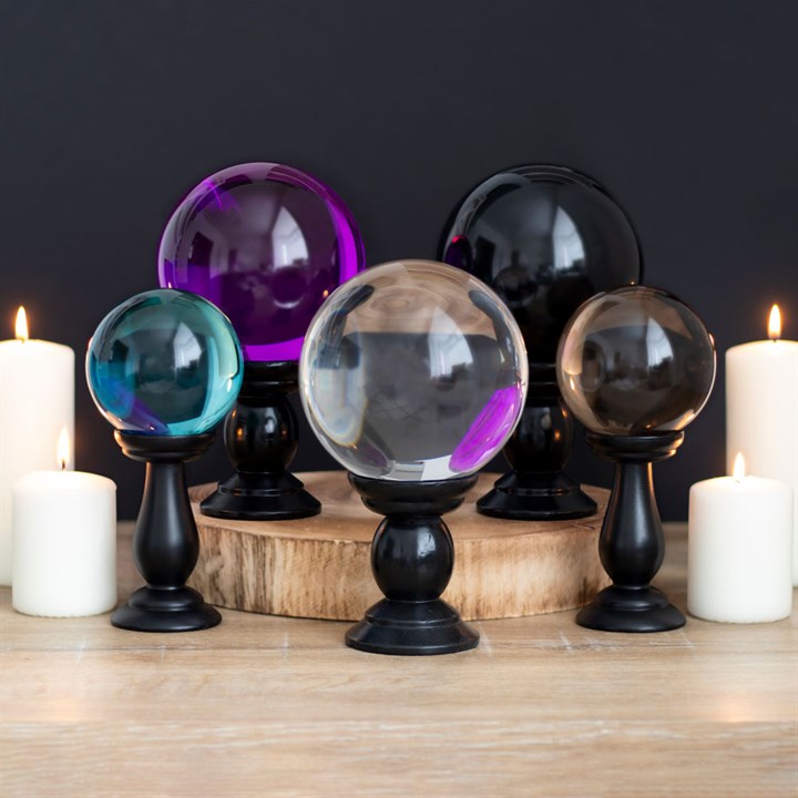 This small, clear crystal ball is not only a powerful tool in fortune telling and scrying, but also makes an eye-catching piece of décor. Whether used for divination or a table accessory at Halloween, this crystal ball is sure to be a conversation piece. Comes on black wooden stand