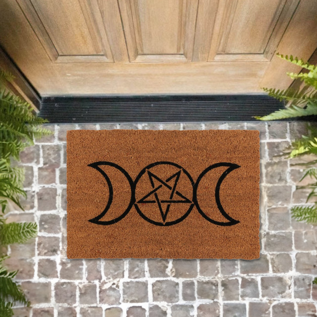 Enhance your home and create a welcoming space with this natural coir doormat printed with a Triple Moon design. The Triple Moon is a popular symbol representing the Triple Goddess and is characterised by a waxing, full and waning moon. Makes a fun welcome at the front door of any witch's lair!