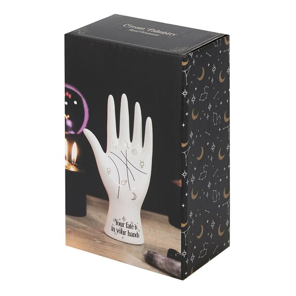 Add some mystic vibes to your space with our White Ceramic Palmistry Hand. This cool take on a classic palmistry hand features metallic gold astrology symbols representing the Sun, Moon, Venus, Mars, Jupiter, Saturn and Mercury and mystical 'Your fate is in your hands' text