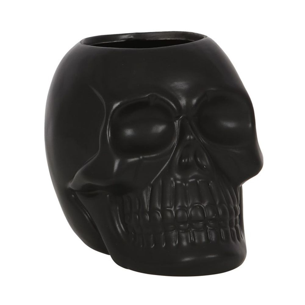 This matt black skull-shaped ceramic pot is a unique piece to finish off a gothic sink space. Perfect for holding pens, makeup brushes, toothbrushes and more