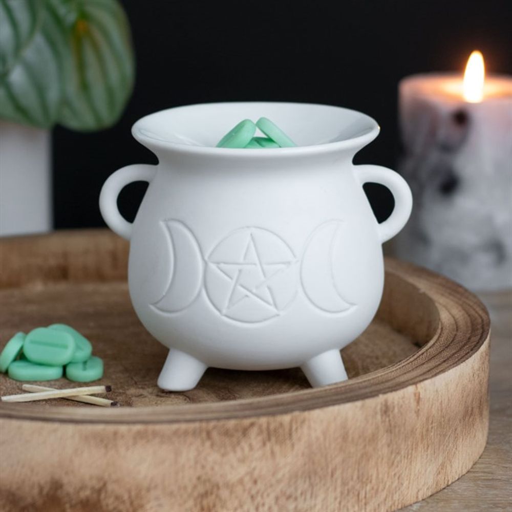 Illuminate your space with this whimsical White Triple Moon Cauldron Oil Burner. Its unique design and functionality create a cosy atmosphere while adding a touch of magic to any room. Perfect for burning your favourite oils and wax melts and creating a serene ambiance. Grab yours now and let the good vibes flow!