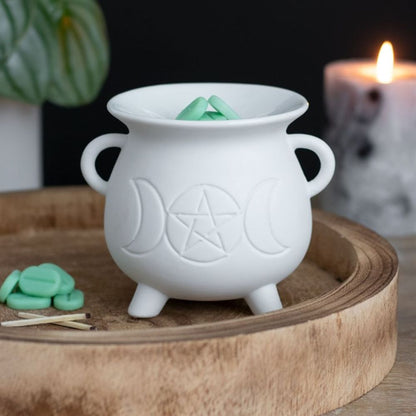 Illuminate your space with this whimsical White Triple Moon Cauldron Oil Burner. Its unique design and functionality create a cosy atmosphere while adding a touch of magic to any room. Perfect for burning your favourite oils and wax melts and creating a serene ambiance. Grab yours now and let the good vibes flow!