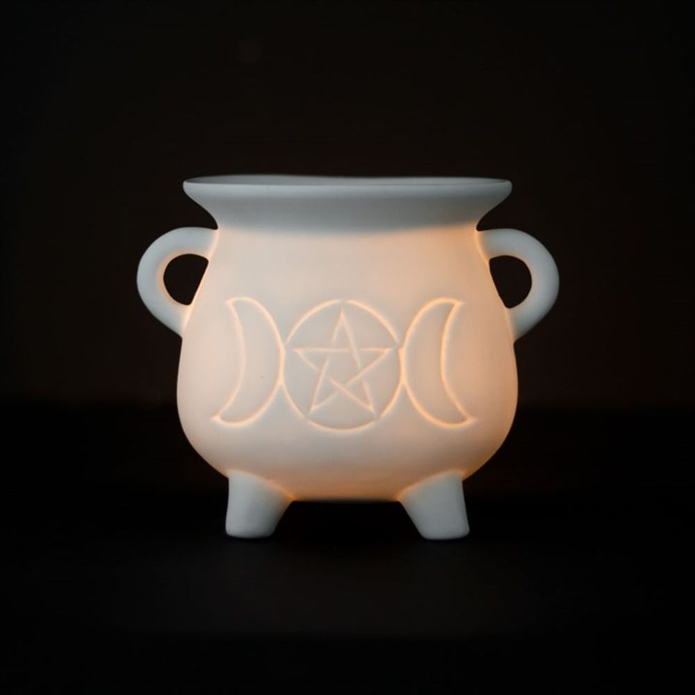 Illuminate your space with this whimsical White Triple Moon Cauldron Oil Burner. Its unique design and functionality create a cosy atmosphere while adding a touch of magic to any room. Perfect for burning your favourite oils and wax melts and creating a serene ambiance. Grab yours now and let the good vibes flow!